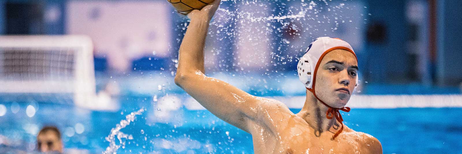 Water polo player throwing ball