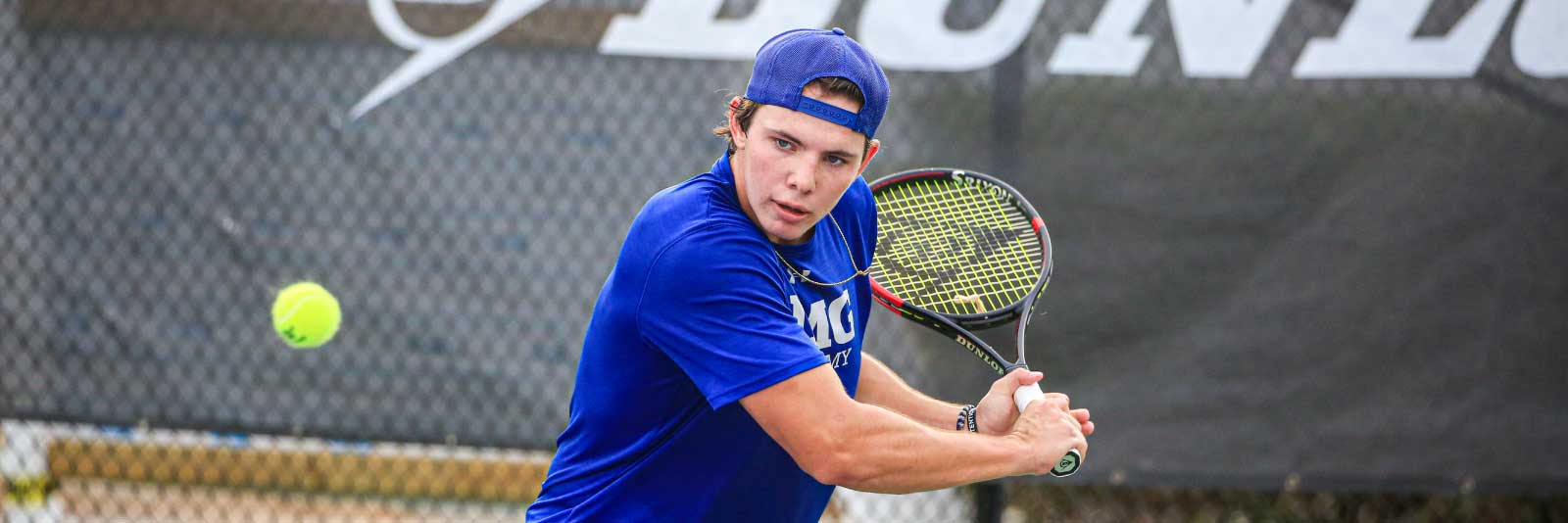 IMG male tennis player on court