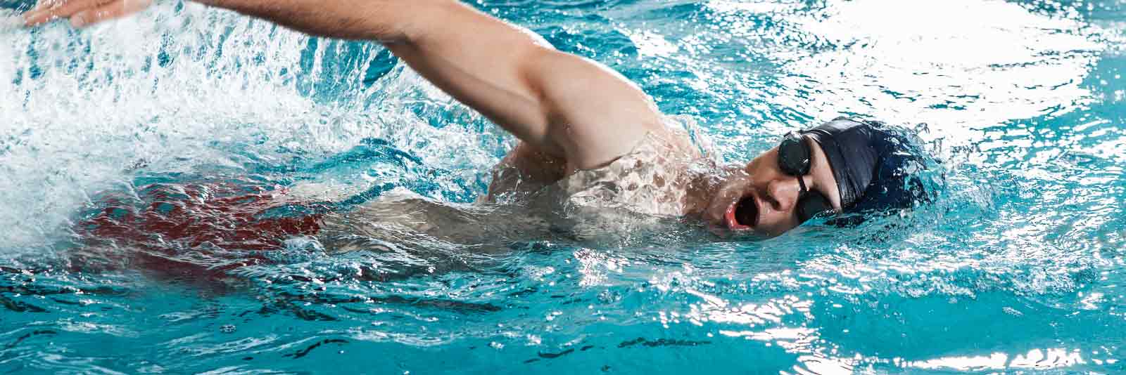 IMG male swimmer swimming freestyle