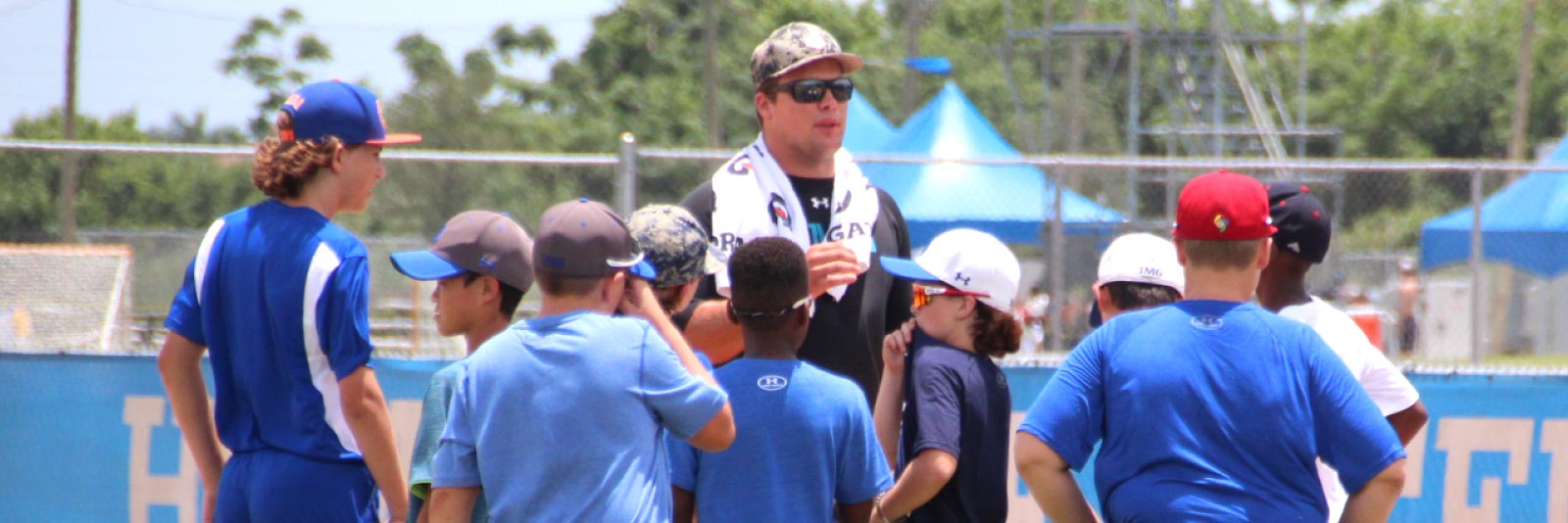 Coach with young athletes in a huddle